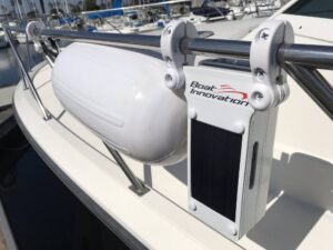 An Automatic Fender System set next to a boat fender